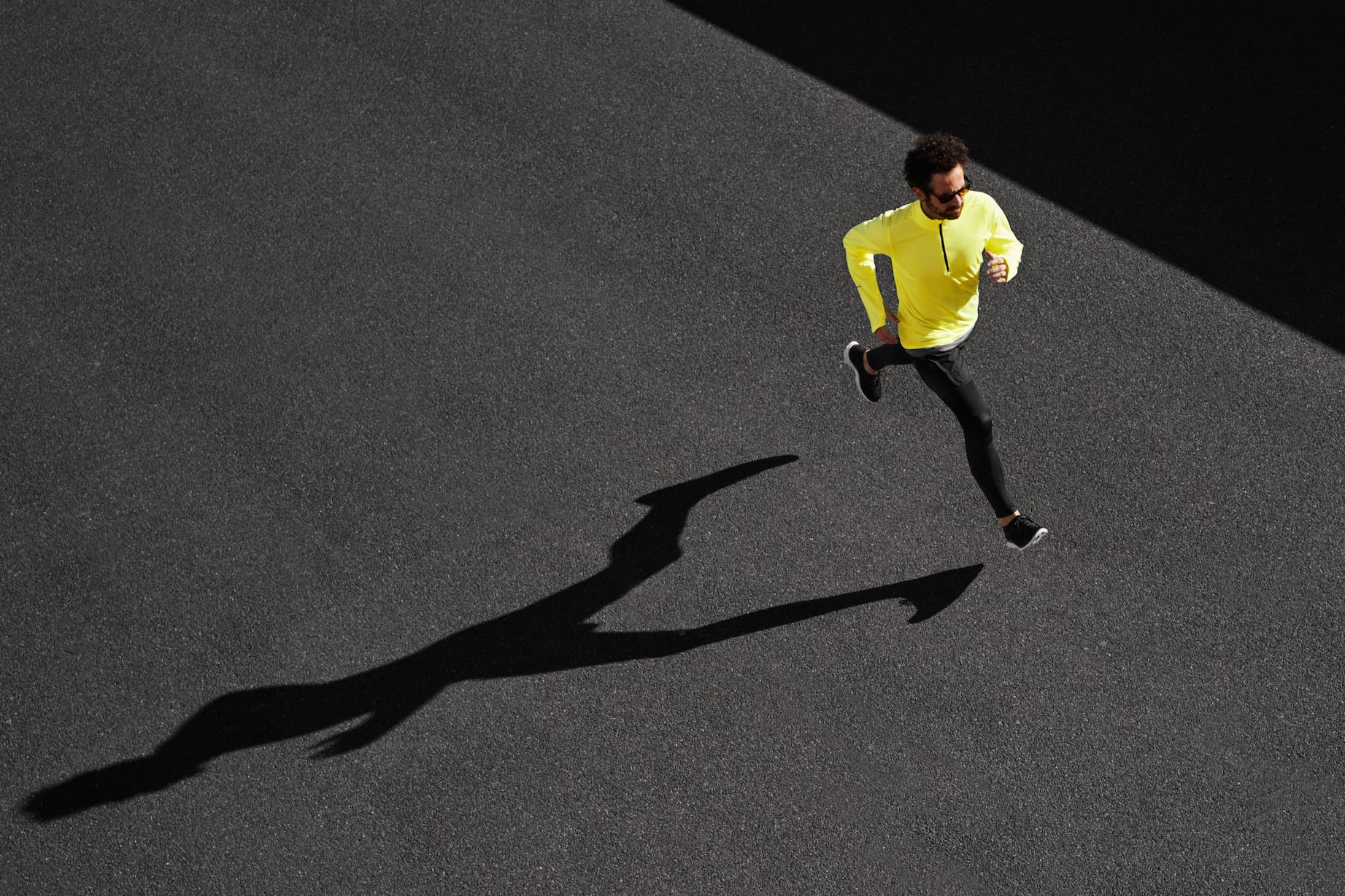 Man in yellow top running